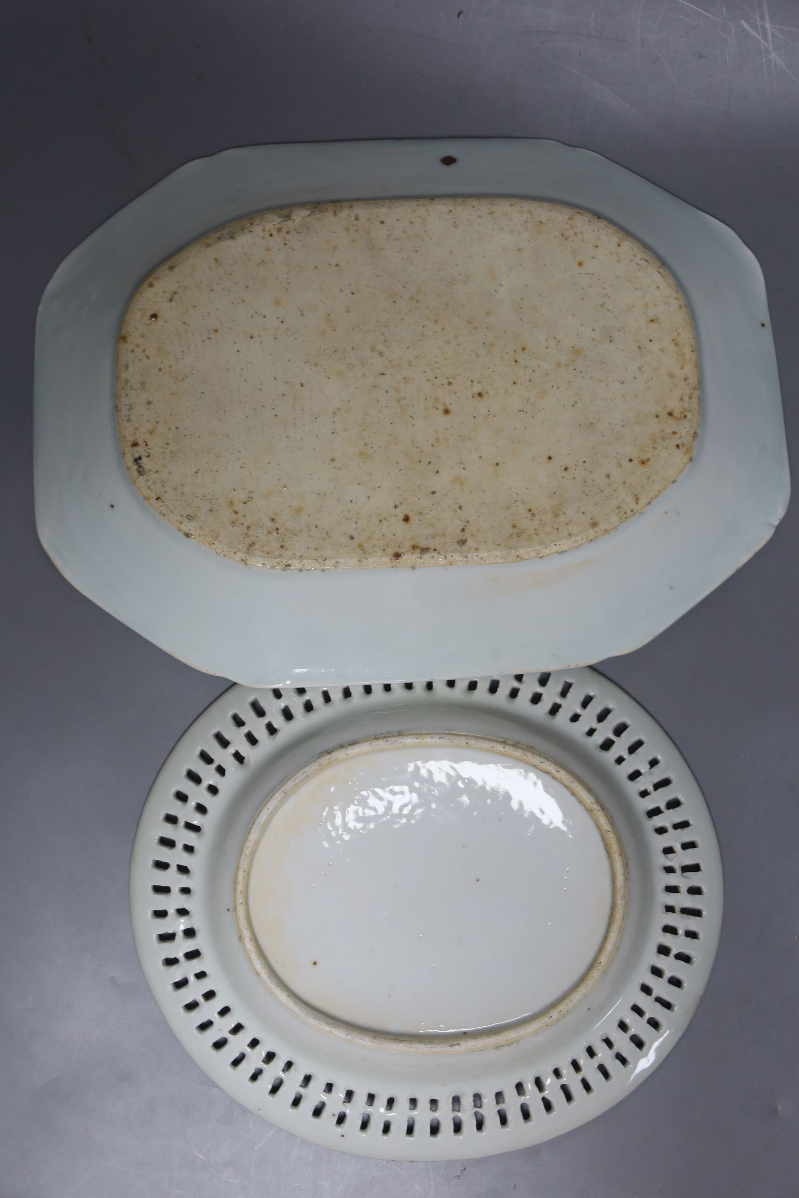 Two 19th century Chinese blue and white dishes and various jars and brush pots, largest item meat platter 33cms wide.